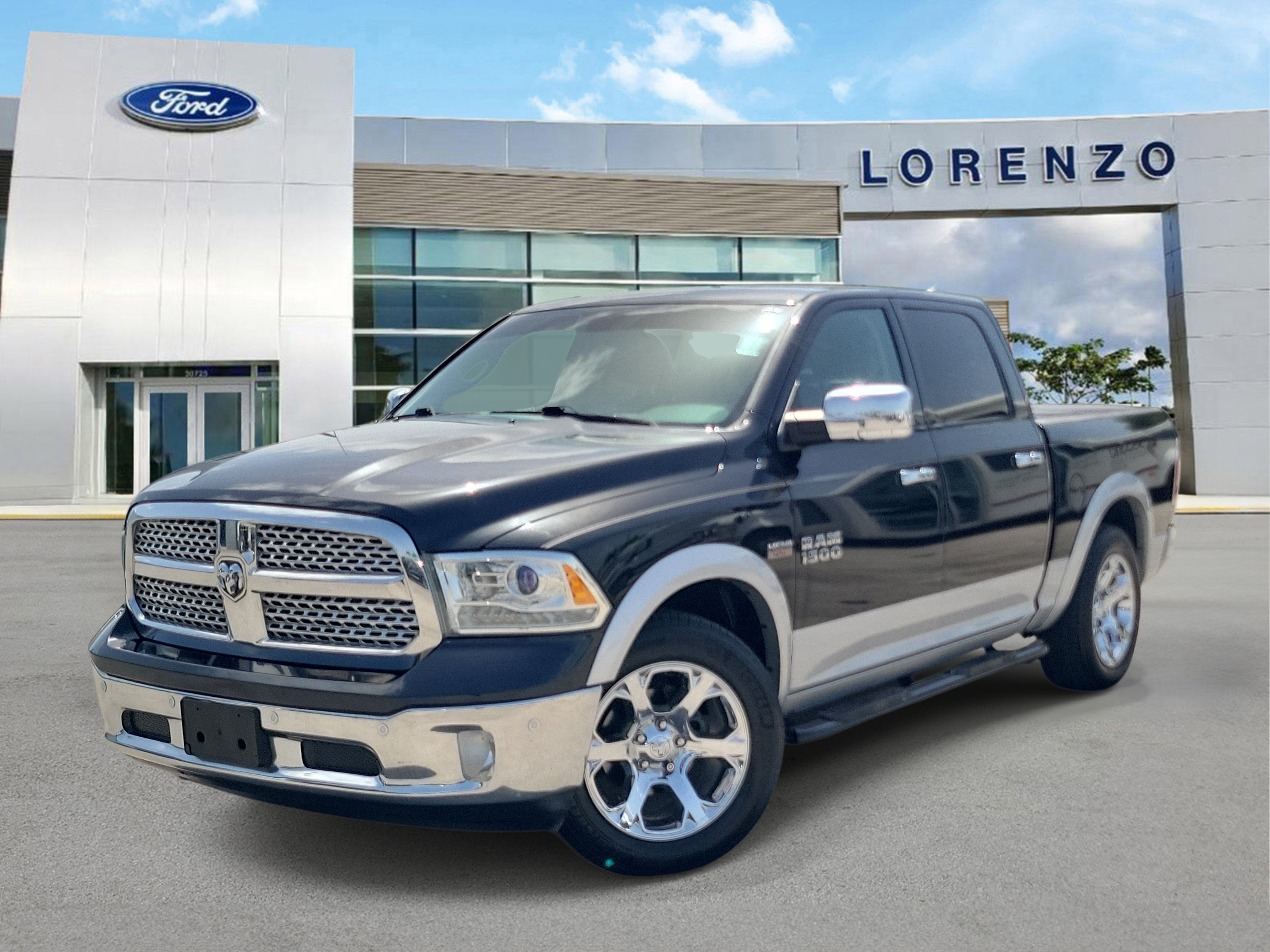 2016 RAM 1500 Laramie in Brilliant Black Crystal Pearlcoat — front three-quarter view